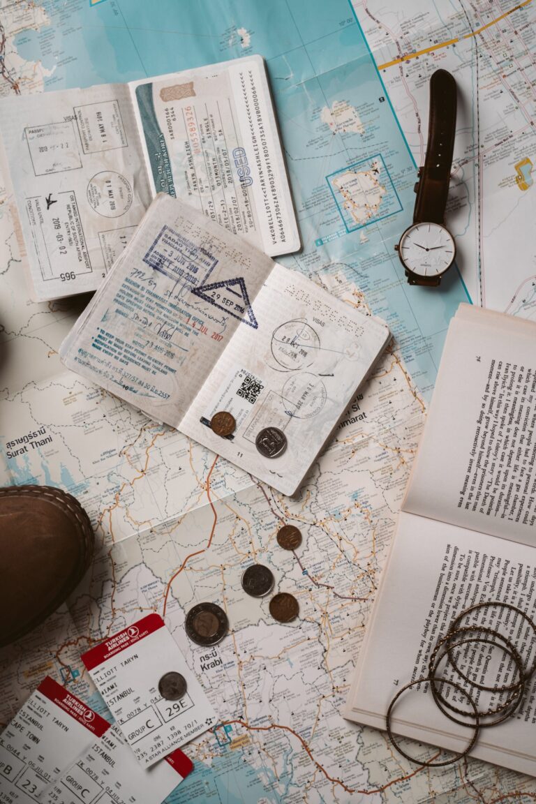 passports and travel plans on top of a map.